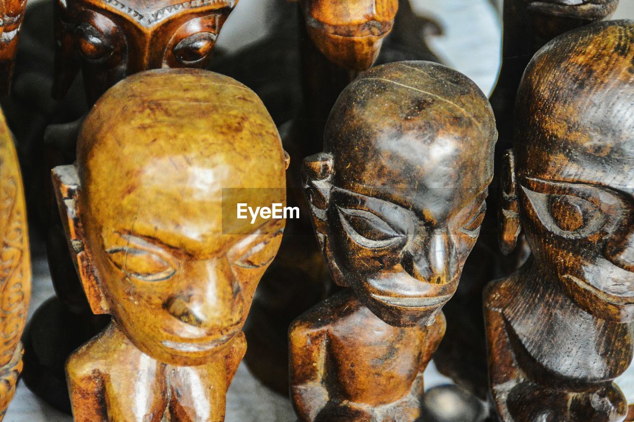 High angle view of wooden figurines at market stall