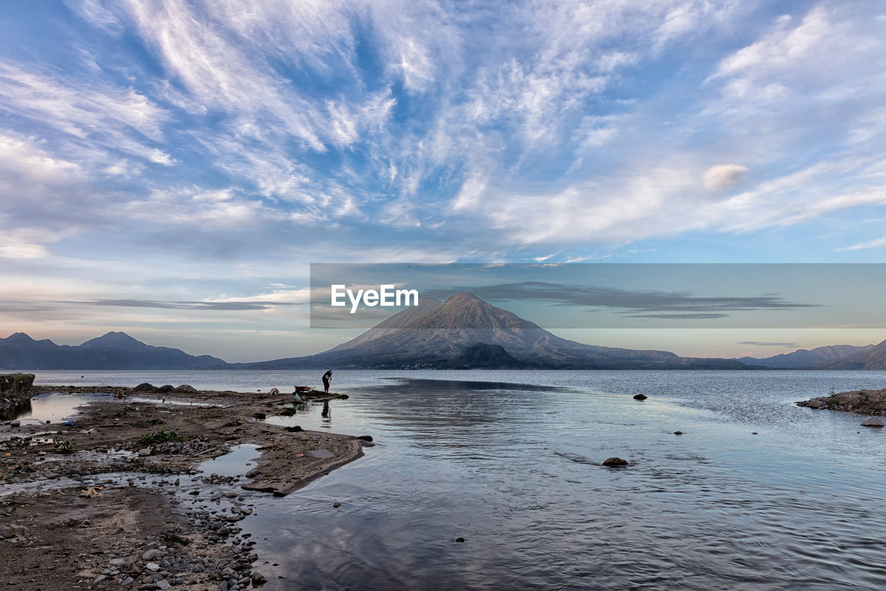 Scenic view of lake and volcano in guatemala.