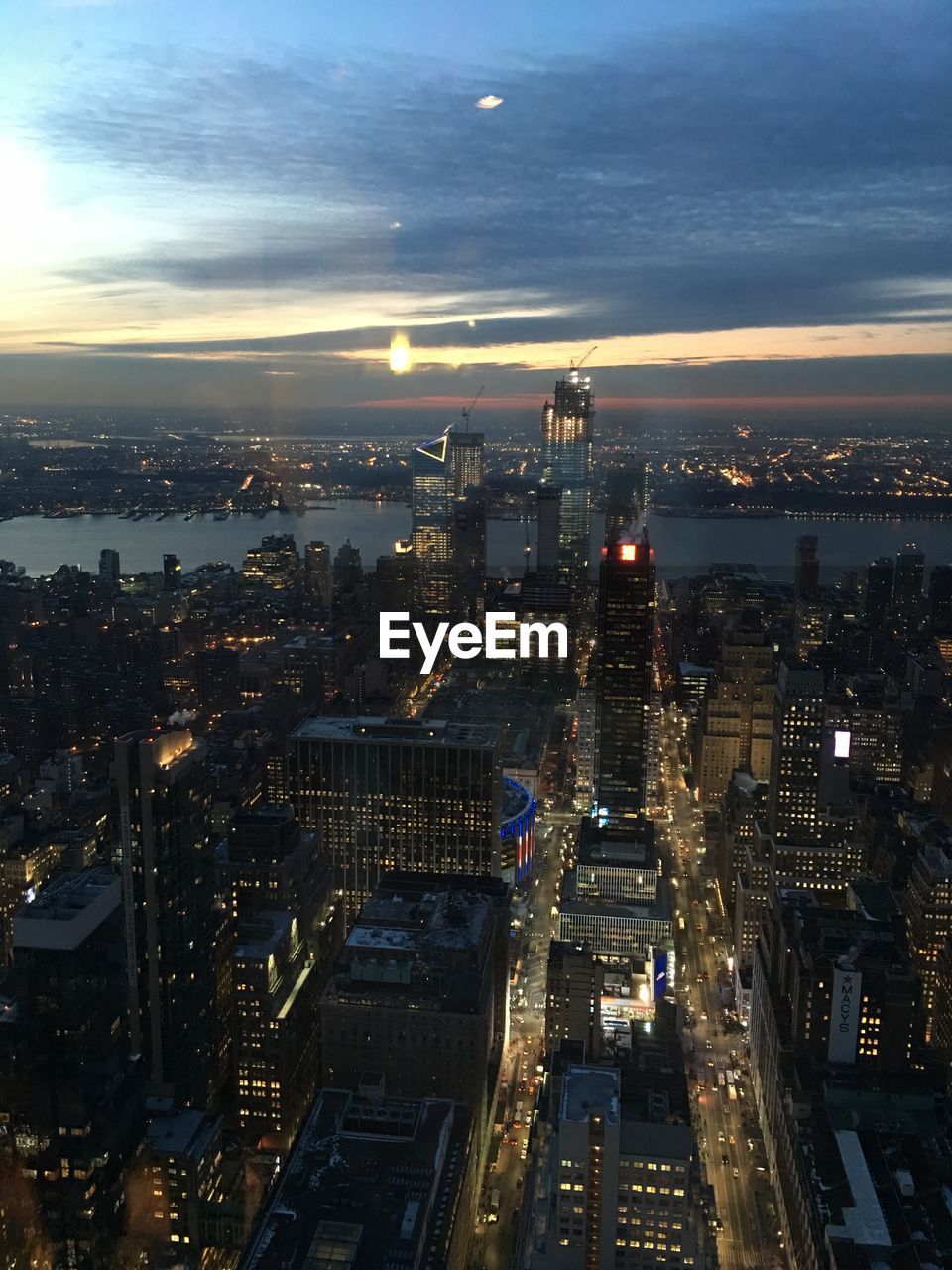 High angle view of illuminated city buildings at night