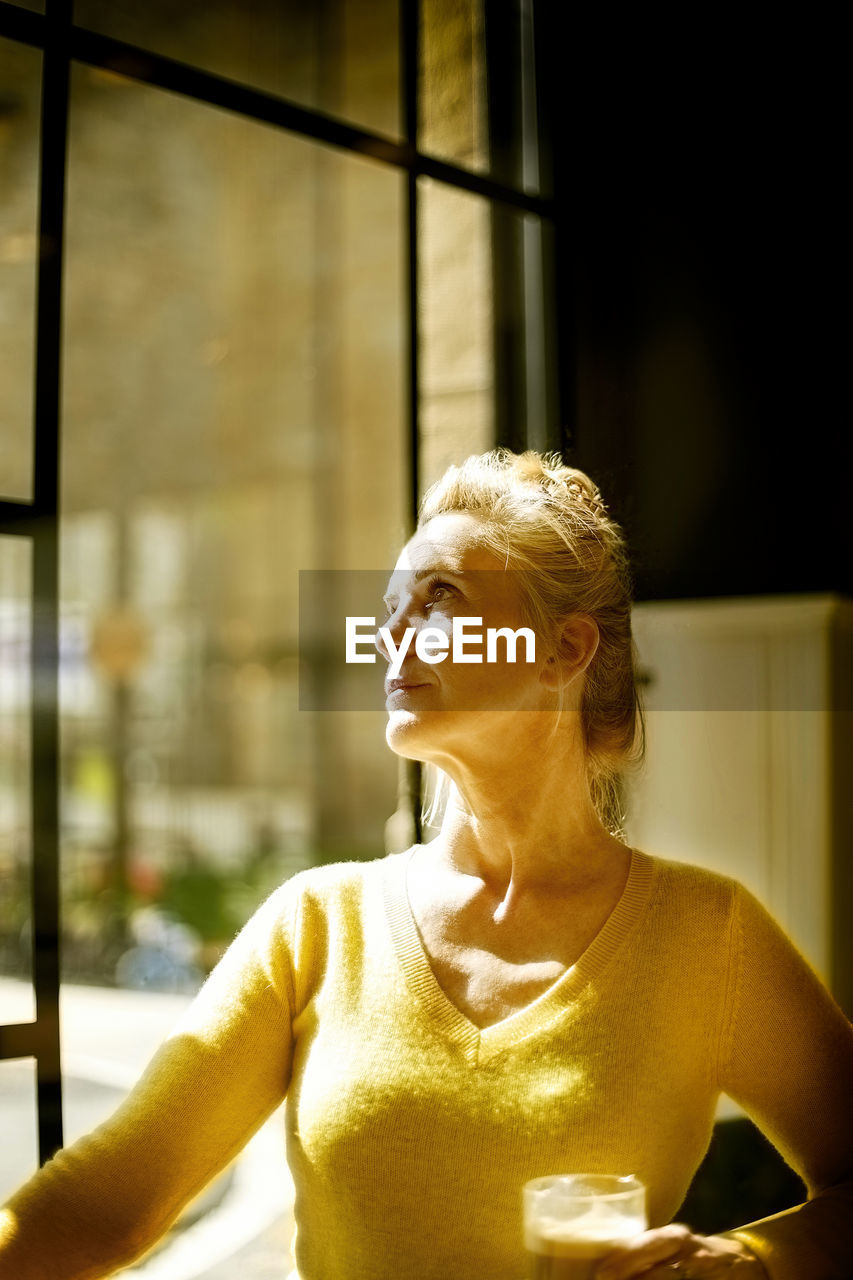 Woman with coffee in a restaurant