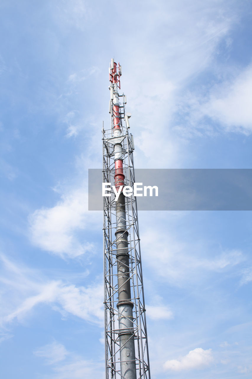 Low angle view of communications tower against sky