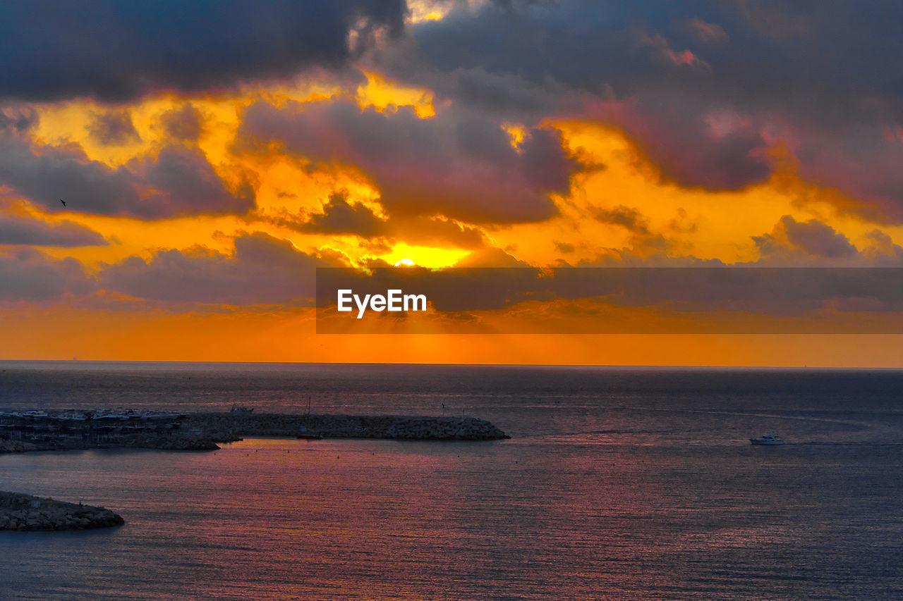 Scenic view of sea against sky during sunset