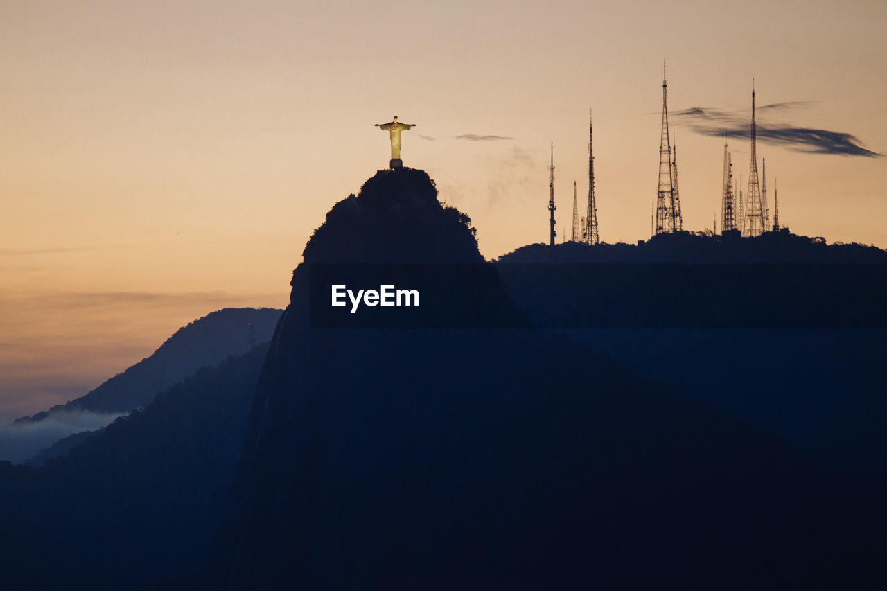 Christ the redeemer statue on mountain during sunset