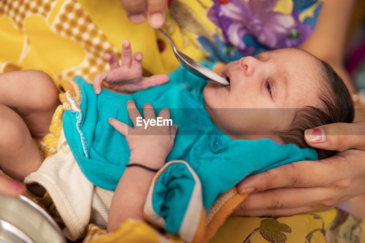 close-up of boy playing with toy at home