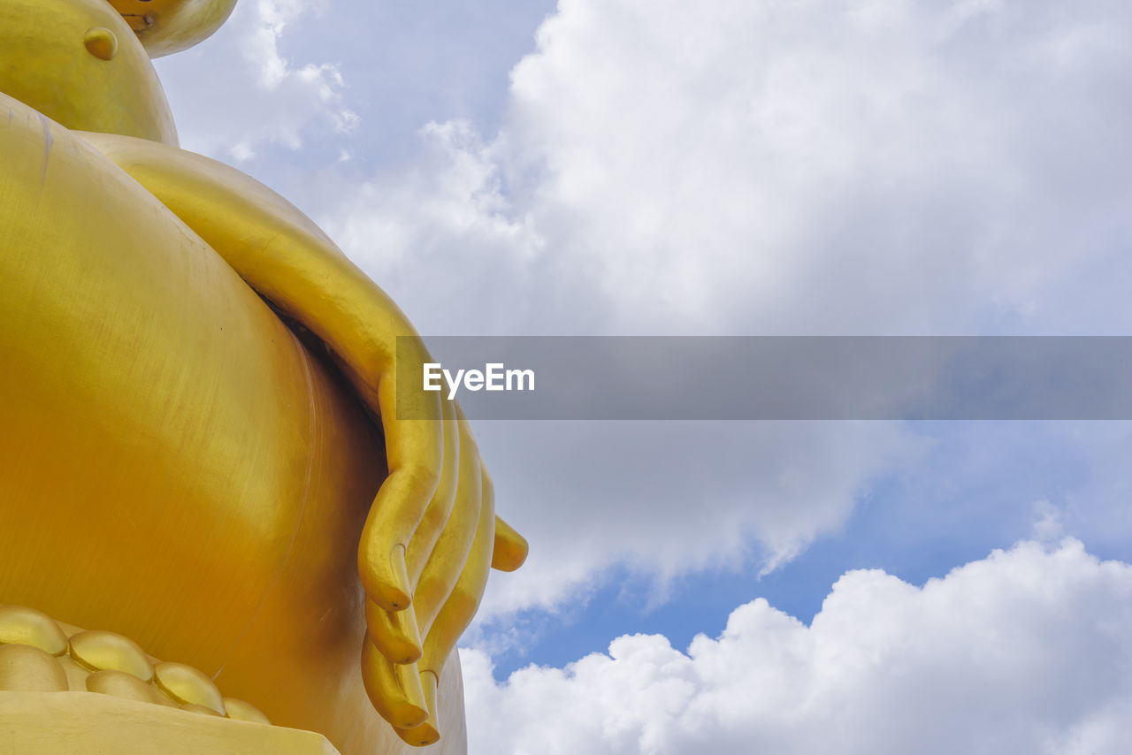 LOW ANGLE VIEW OF A STATUE OF BUDDHA AGAINST SKY