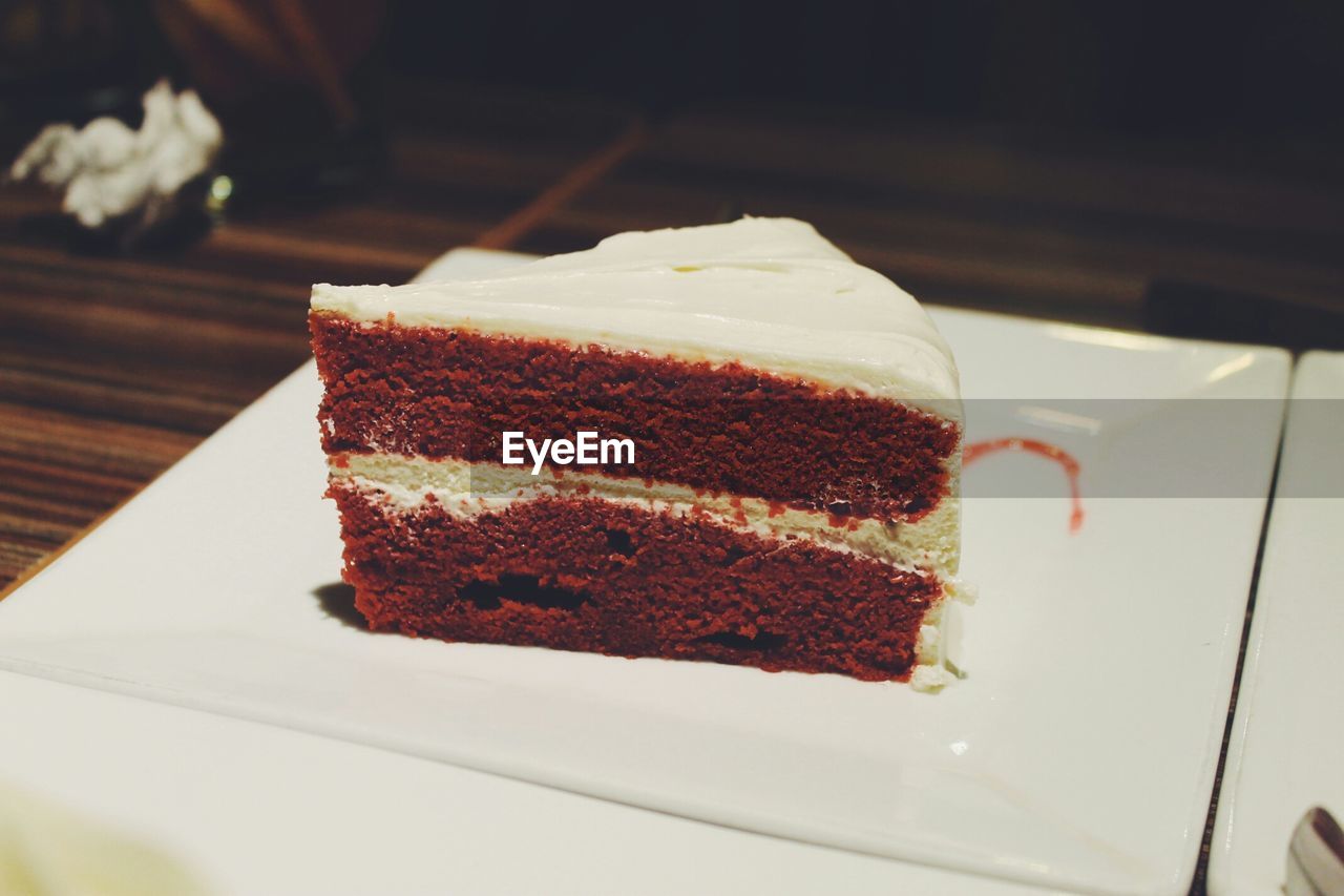 Close-up of served cake slice in plate