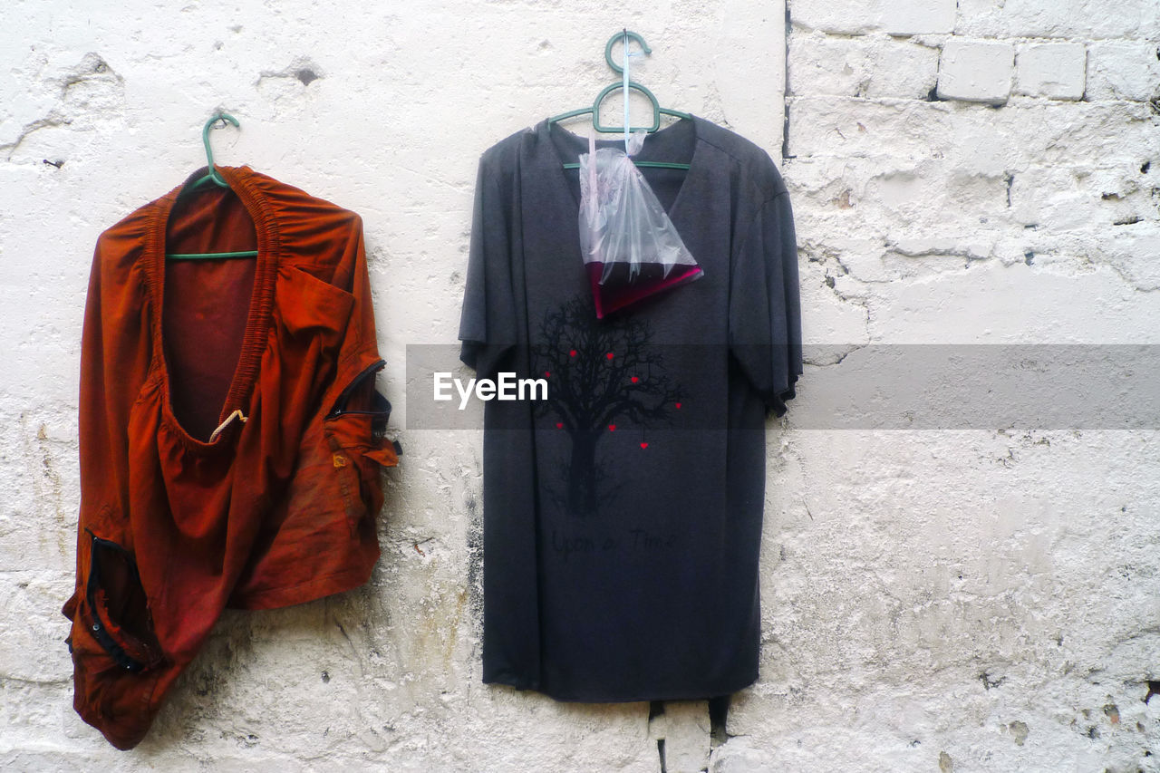 CLOTHES HANGING ON WALL