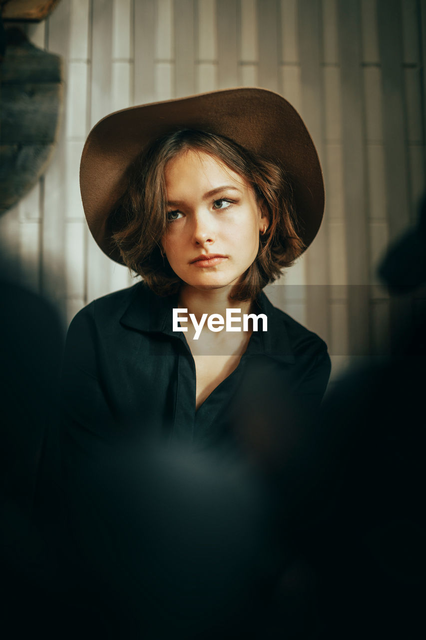 Young woman wearing hat