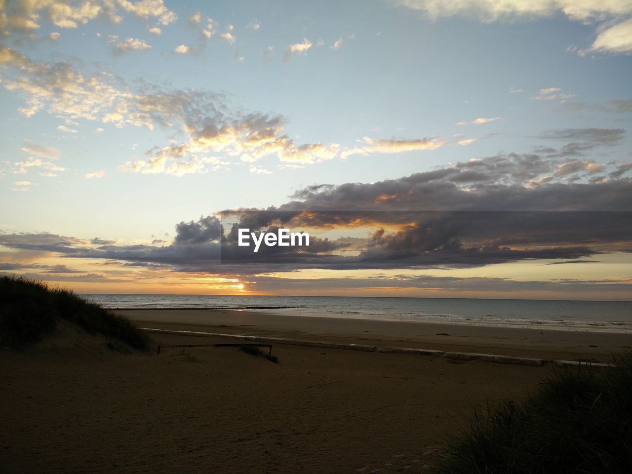 Scenic view of sea at sunset