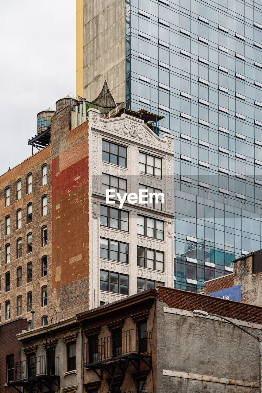 Low angle view of modern buildings against sky