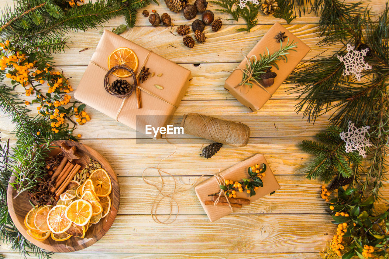 HIGH ANGLE VIEW OF BANANAS ON WOODEN TABLE