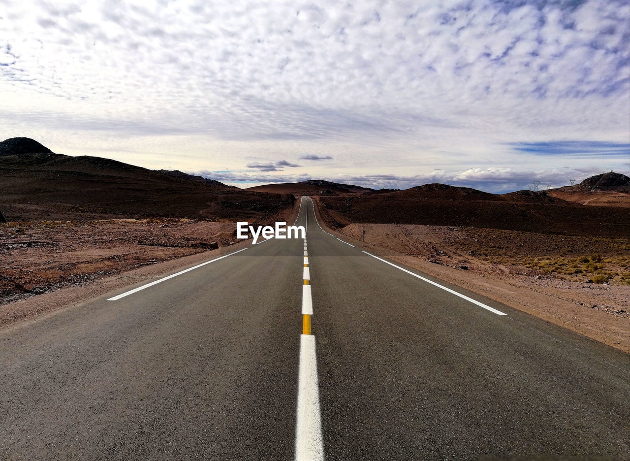 Road amidst landscape against sky