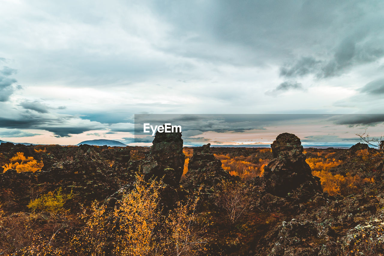 Rock formations on landscape against sky