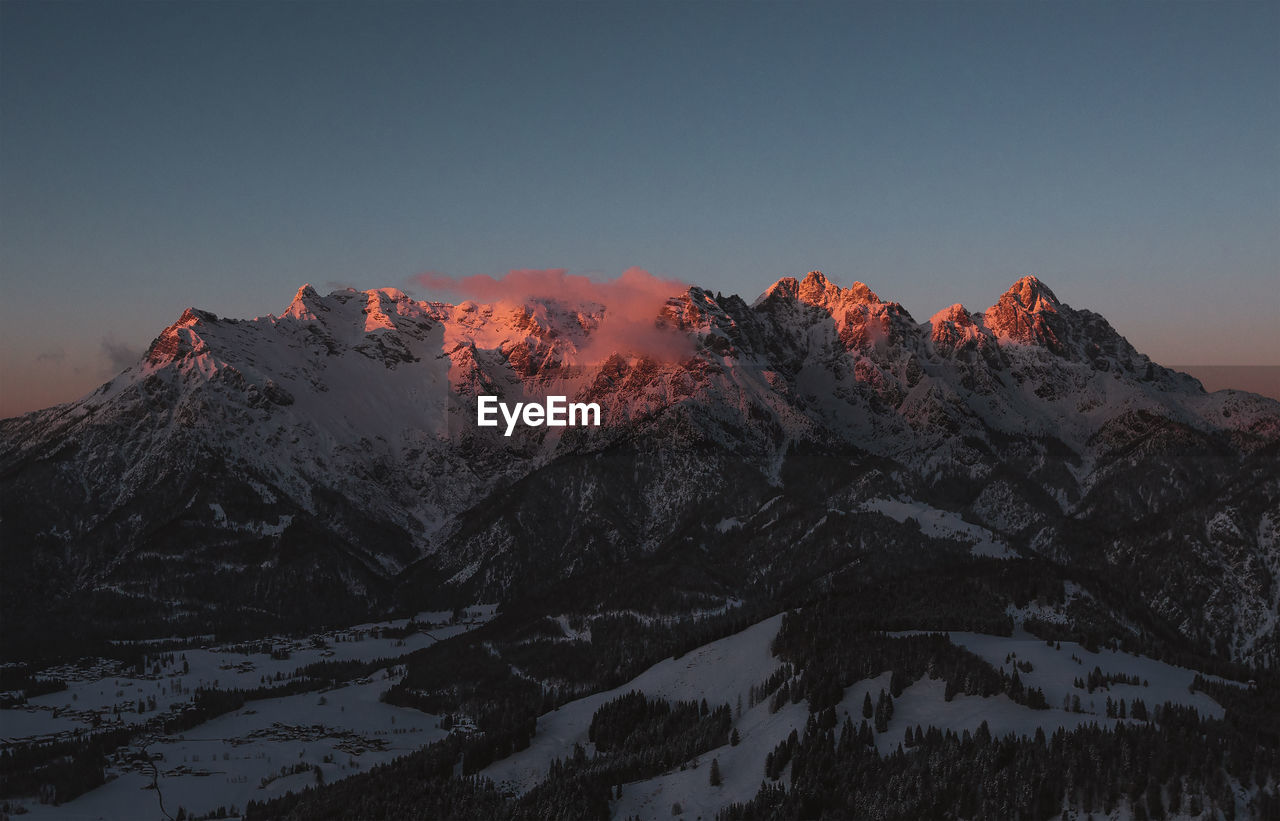 Scenic view of snowcapped mountains against sky during winter