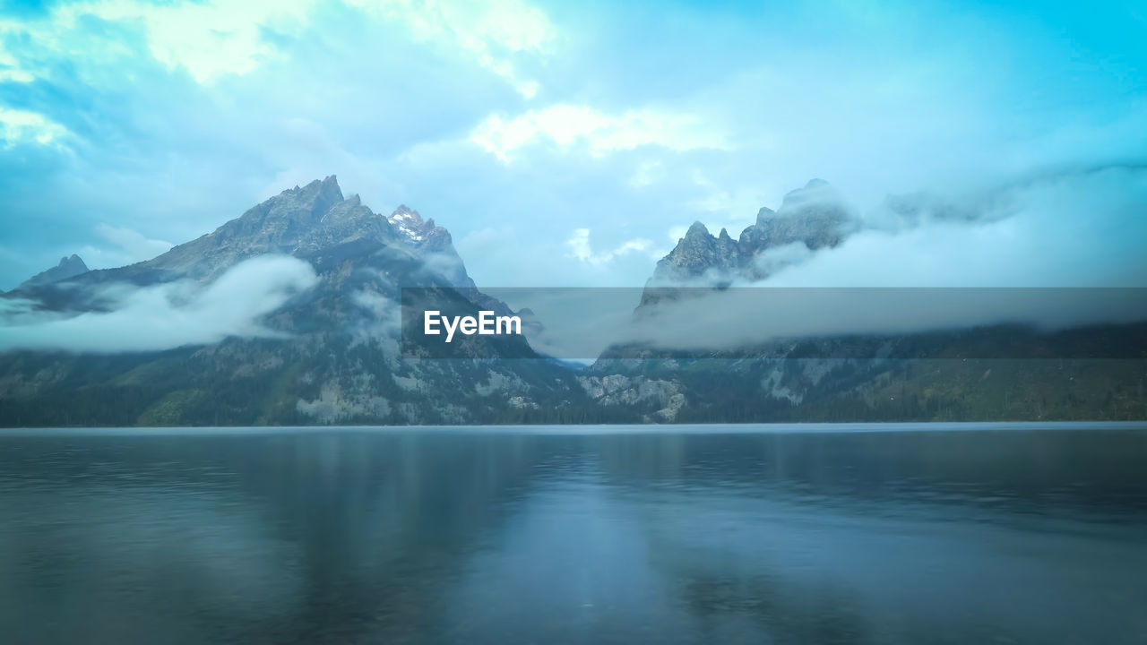 Scenic view of snowcapped mountains against sky,yellowstone wyoming