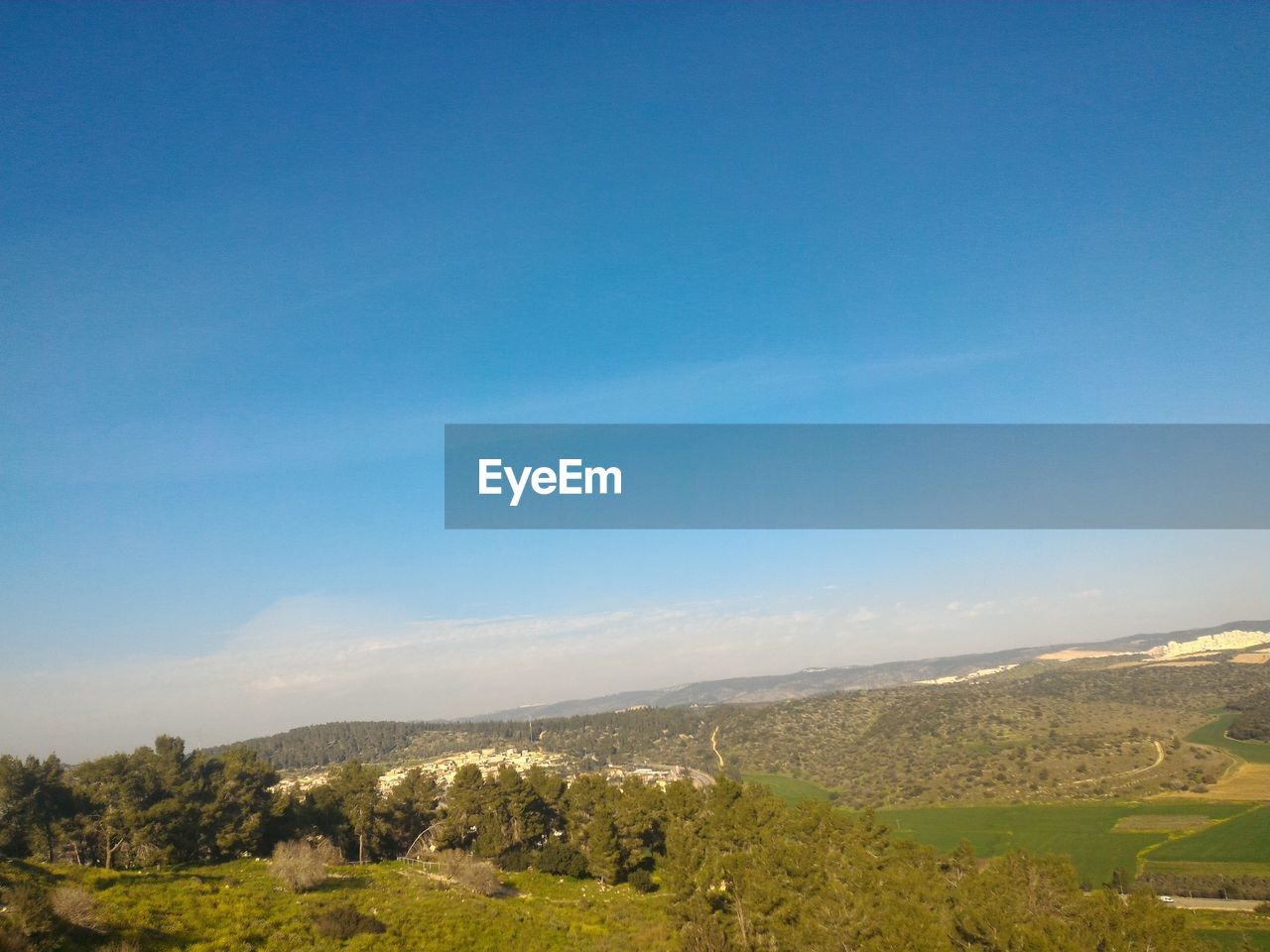 VIEW OF LANDSCAPE AGAINST BLUE SKY