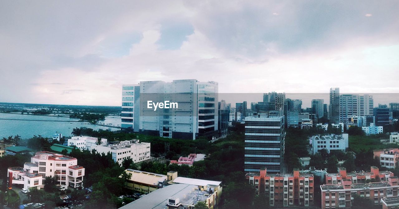 High angle view of city against cloudy sky