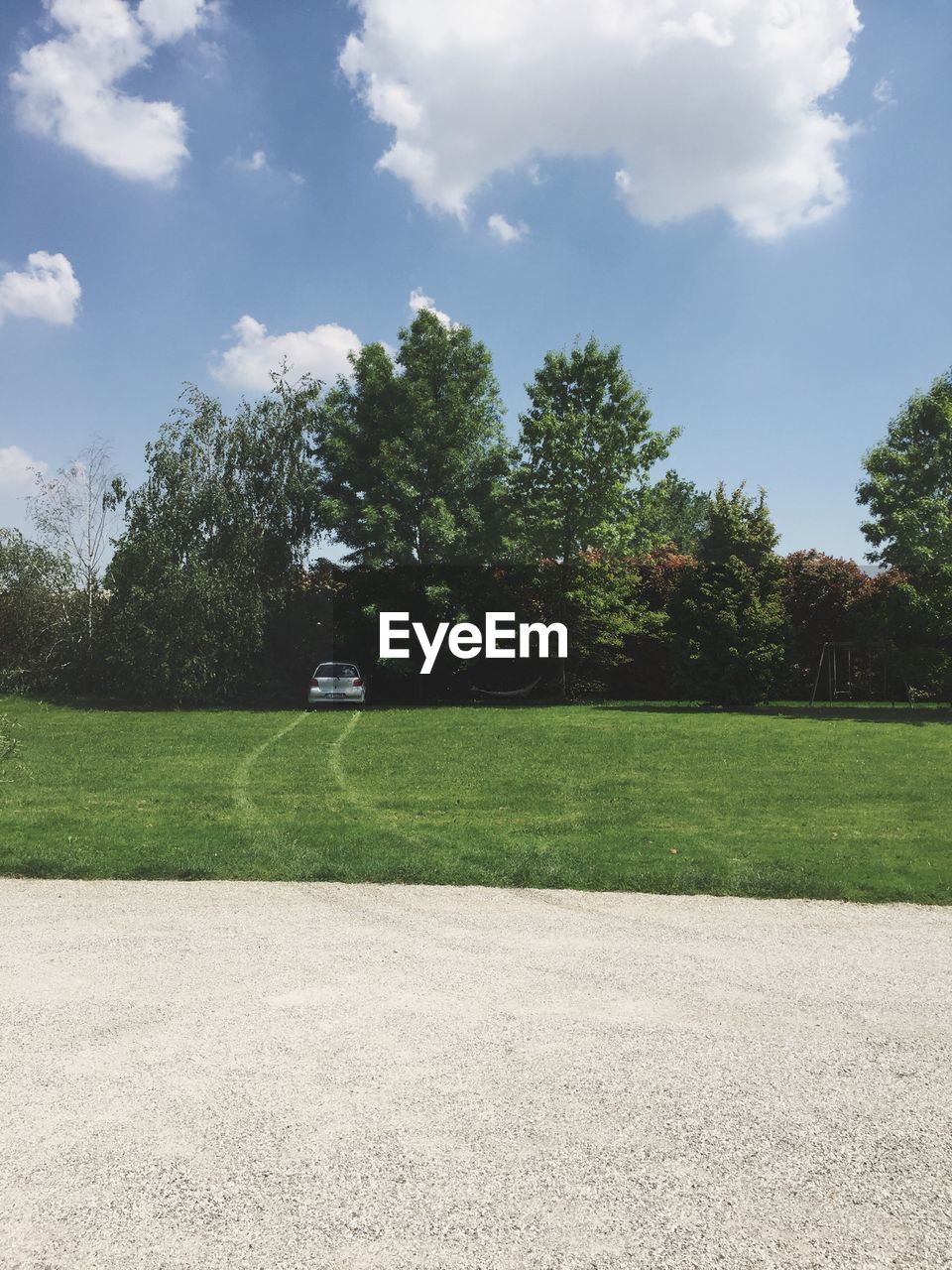 Scenic view of grassy field against sky