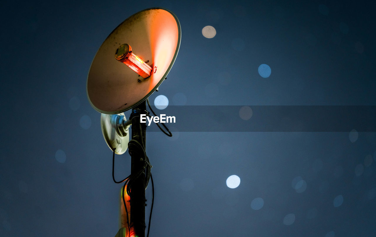 Low angle view of satellite dish against sky at night