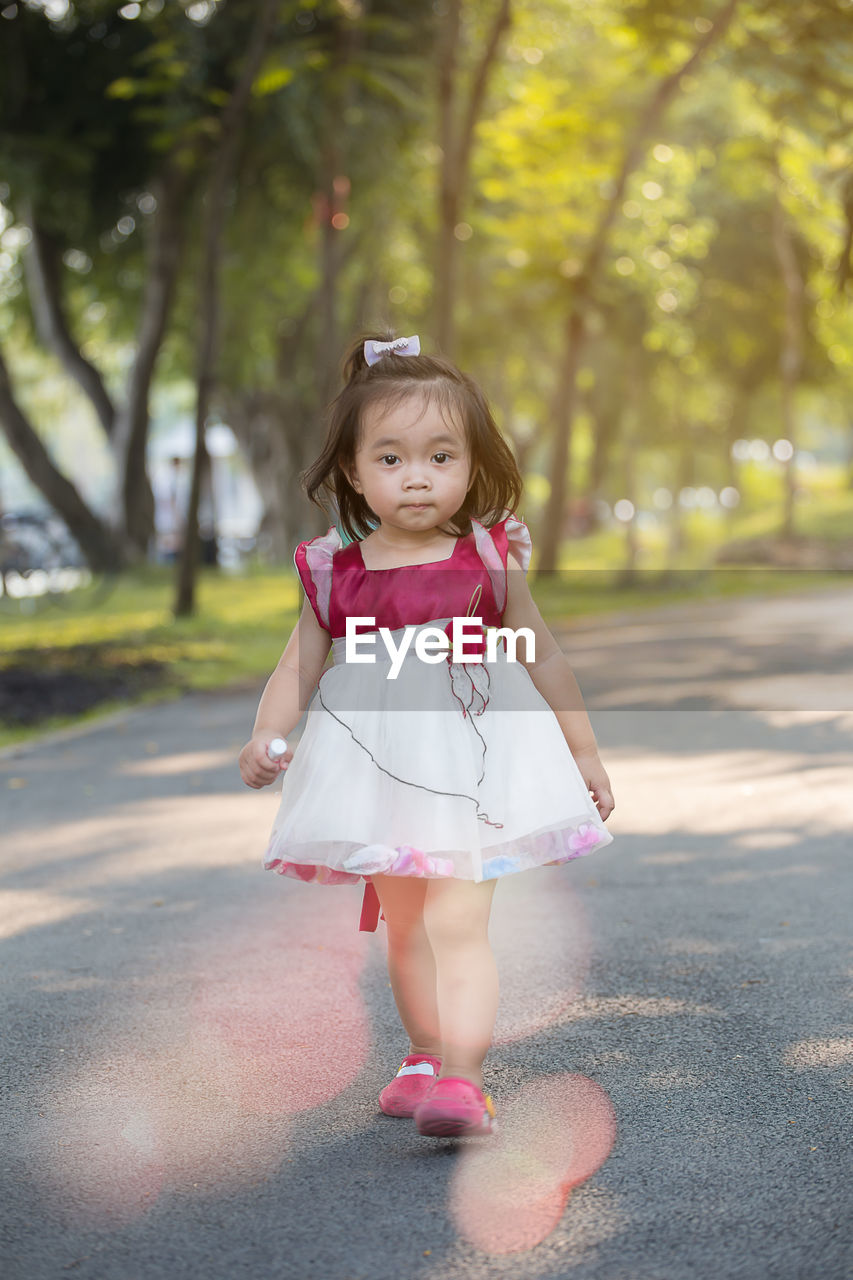 Cute girl walking on road