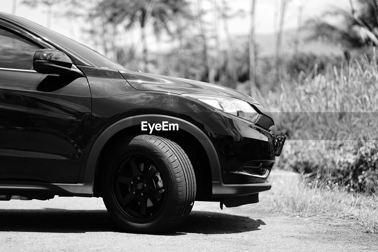 car, vehicle, mode of transportation, transportation, motor vehicle, land vehicle, automobile, wheel, road, sport utility vehicle, retro styled, nature, automotive exterior, day, driving, focus on foreground, plant, outdoors, tire, compact sport utility vehicle