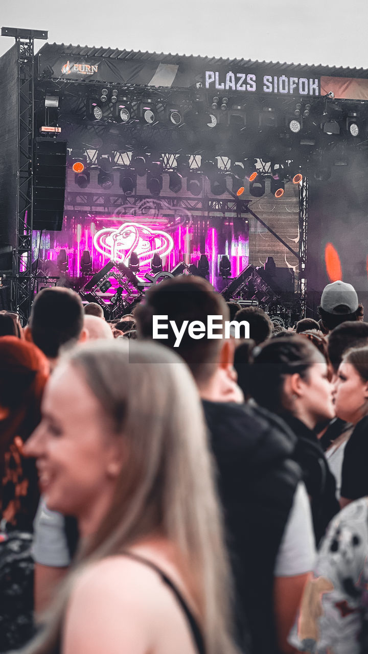 crowd, group of people, event, arts culture and entertainment, music, enjoyment, adult, performance, women, large group of people, men, audience, concert, togetherness, nightlife, young adult, party, celebration, selective focus, emotion, stage, happiness, night, fun, music festival