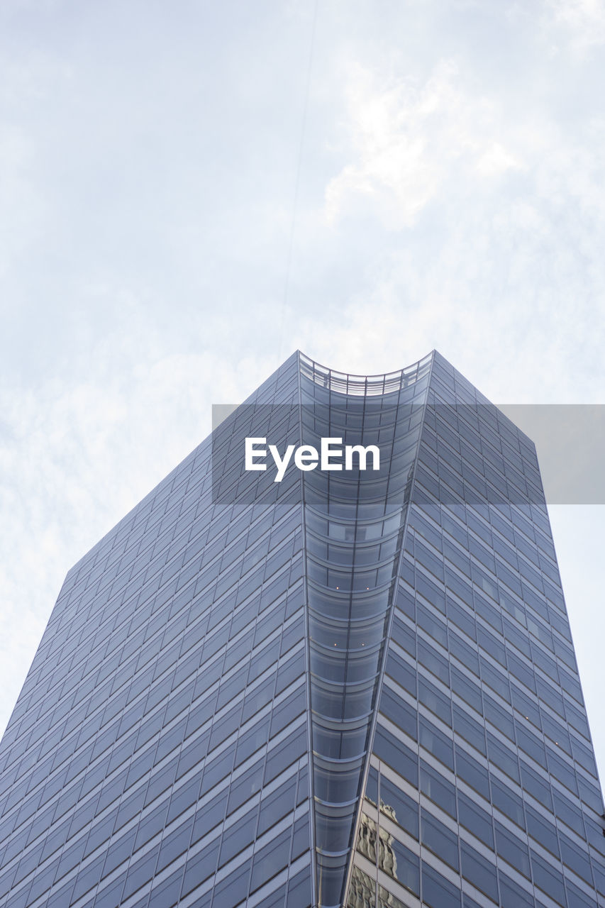 LOW ANGLE VIEW OF MODERN BUILDINGS AGAINST SKY