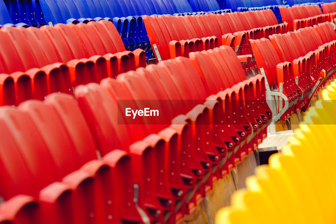 Close-up of empty seats in stadium