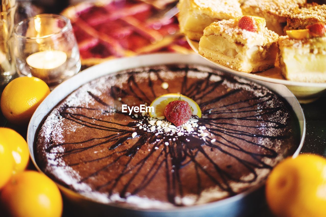 Close-up of dessert and fruits on table