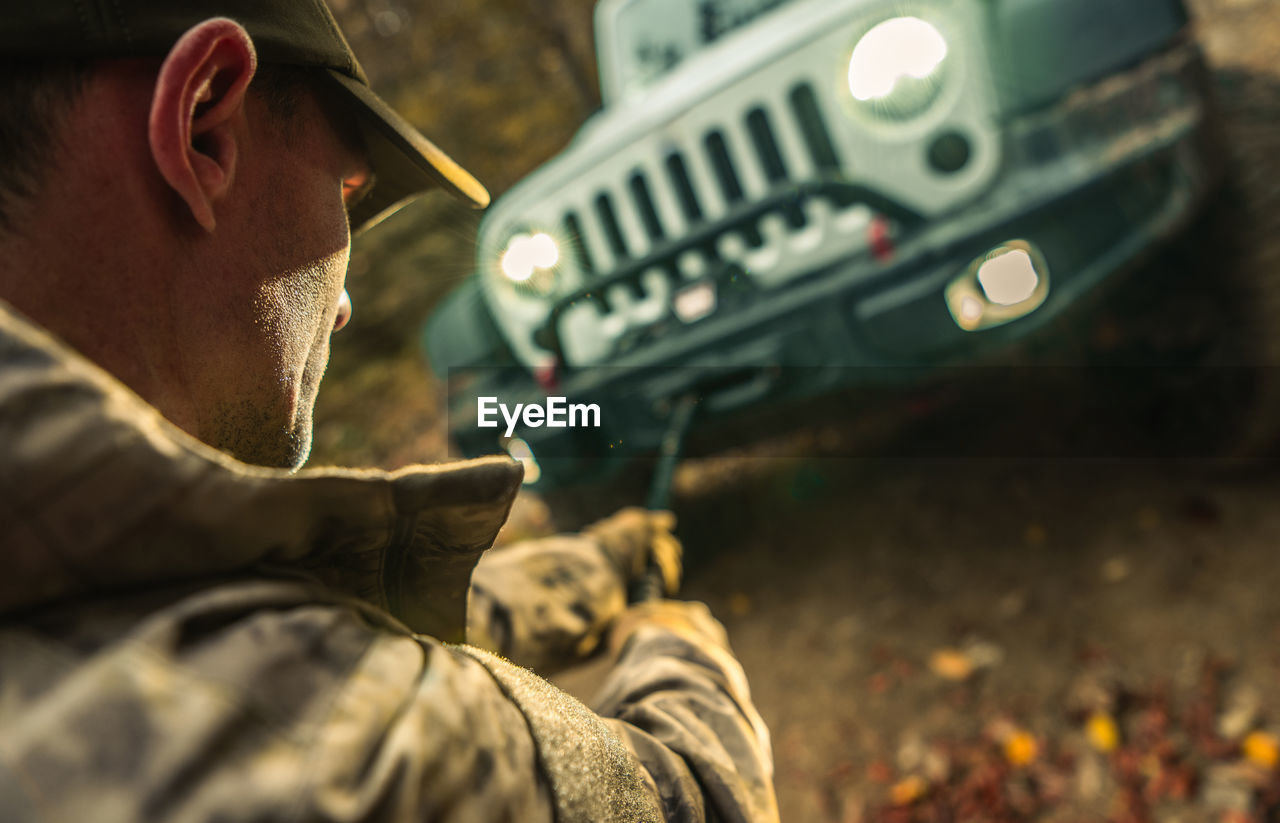 side view of young man photographing