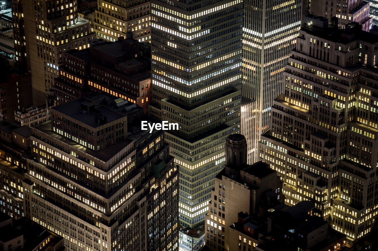 Aerial view of illuminated city at night