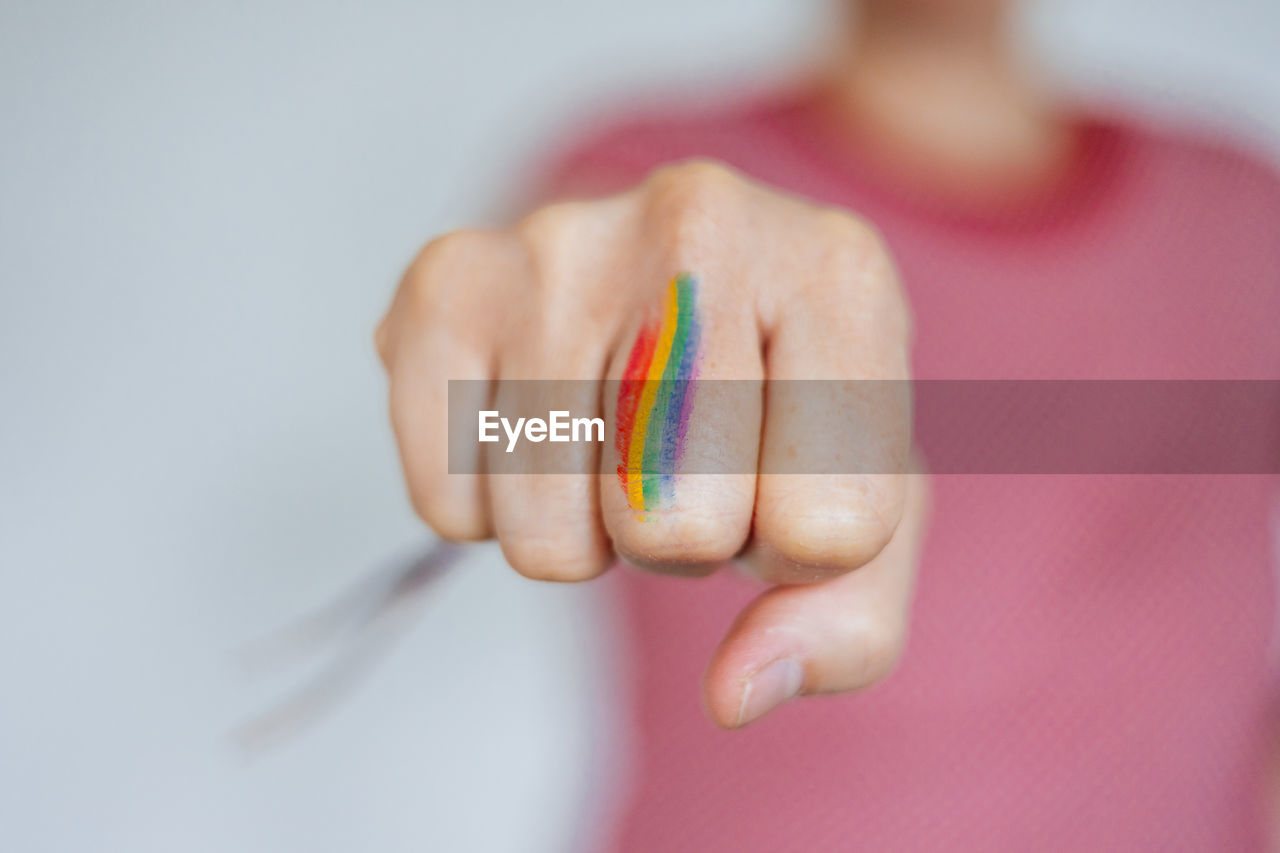 Fist painted with the rainbow flag lgbtq