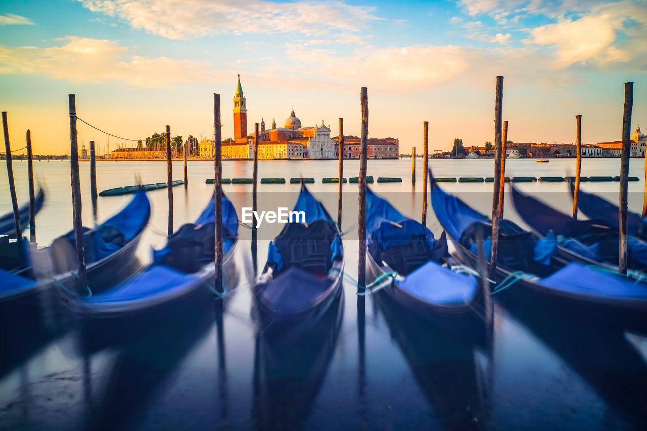 VIEW OF MOORED BOATS IN CITY