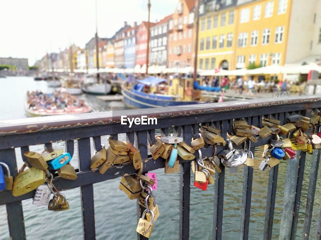 Padlocks on bridge over the canal in copenhagen, denmark