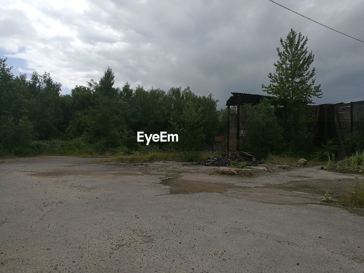 VIEW OF ROAD AGAINST CLOUDY SKY