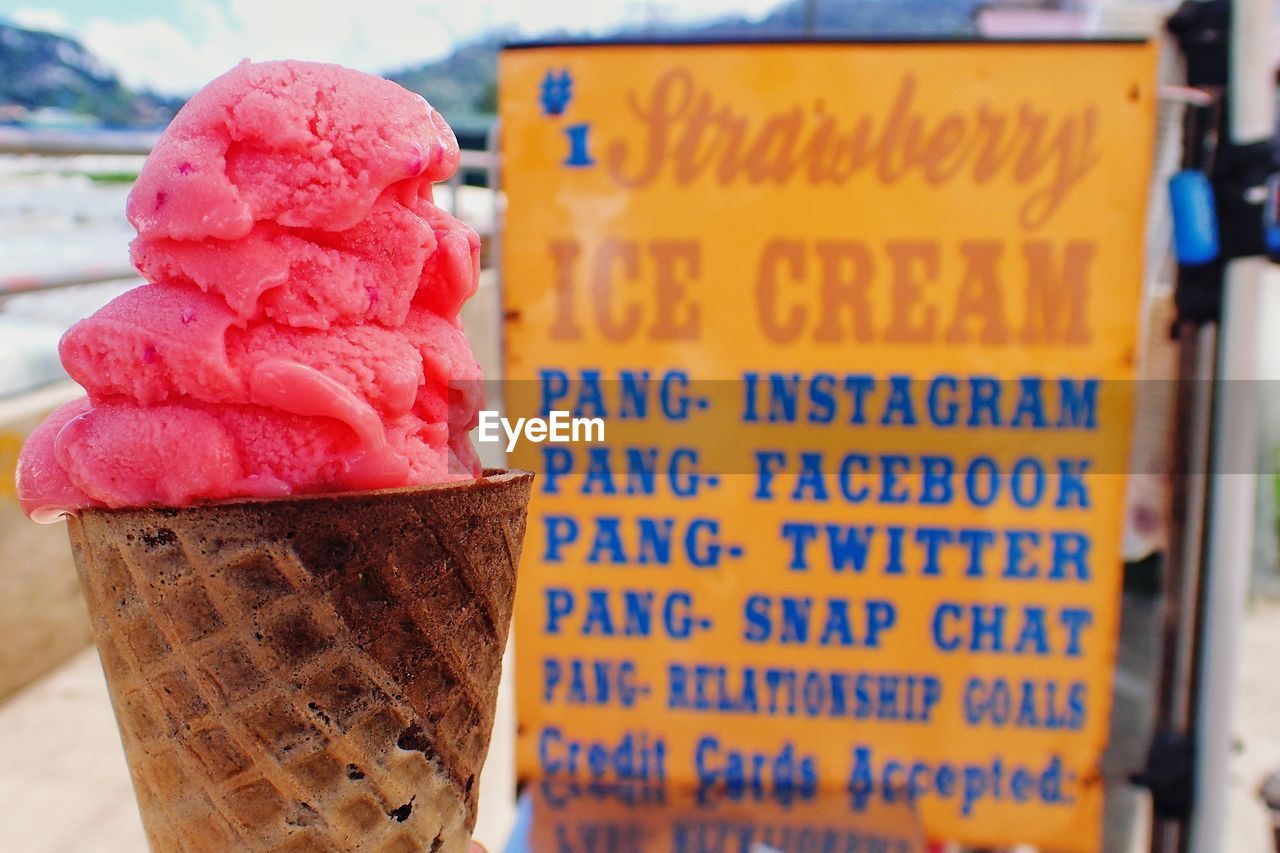 CLOSE-UP OF ICE CREAM WITH TEXT ON GLASS