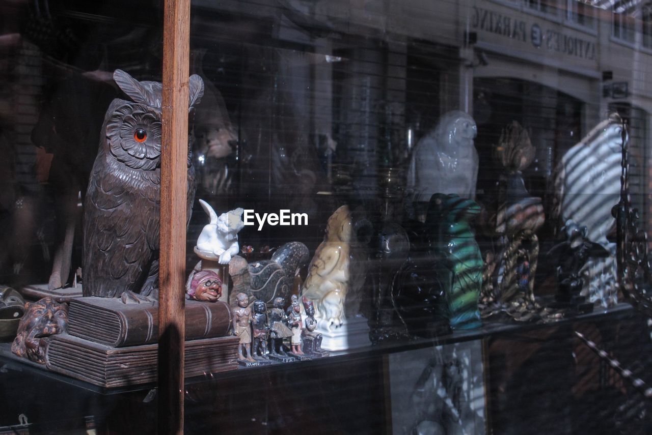 REFLECTION OF GLASS WINDOW IN STORE FOR SALE AT STREET MARKET