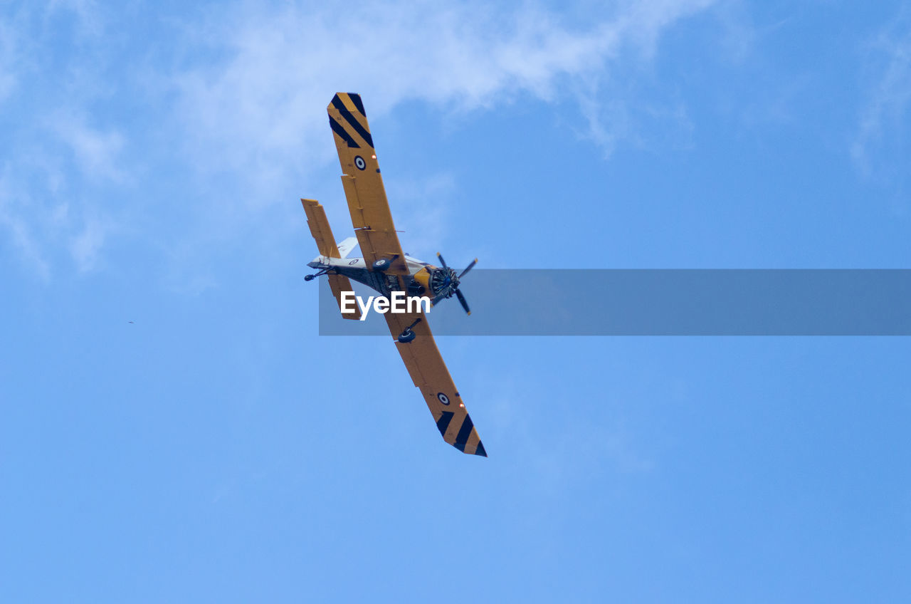LOW ANGLE VIEW OF AIRPLANE AGAINST SKY