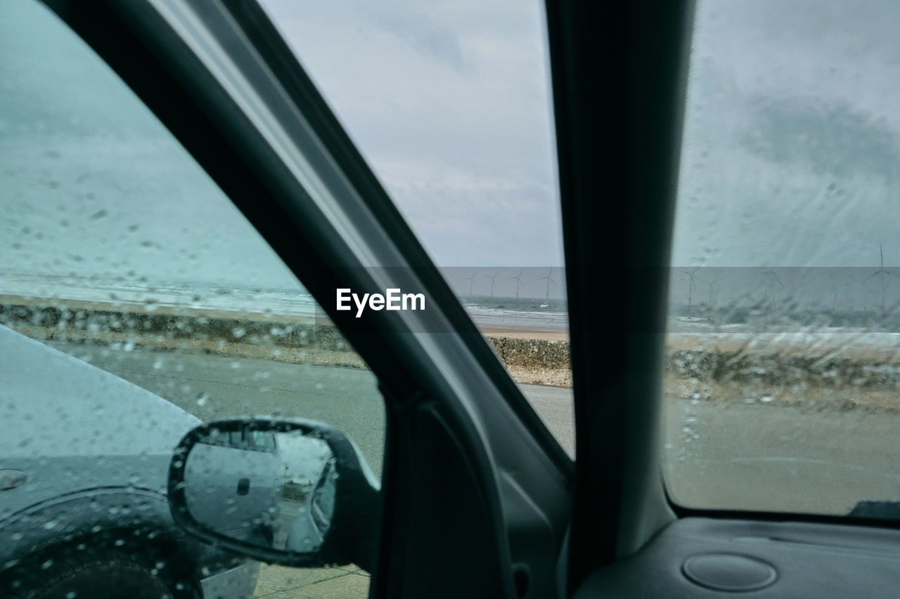 REFLECTION OF CAR ON WINDOW