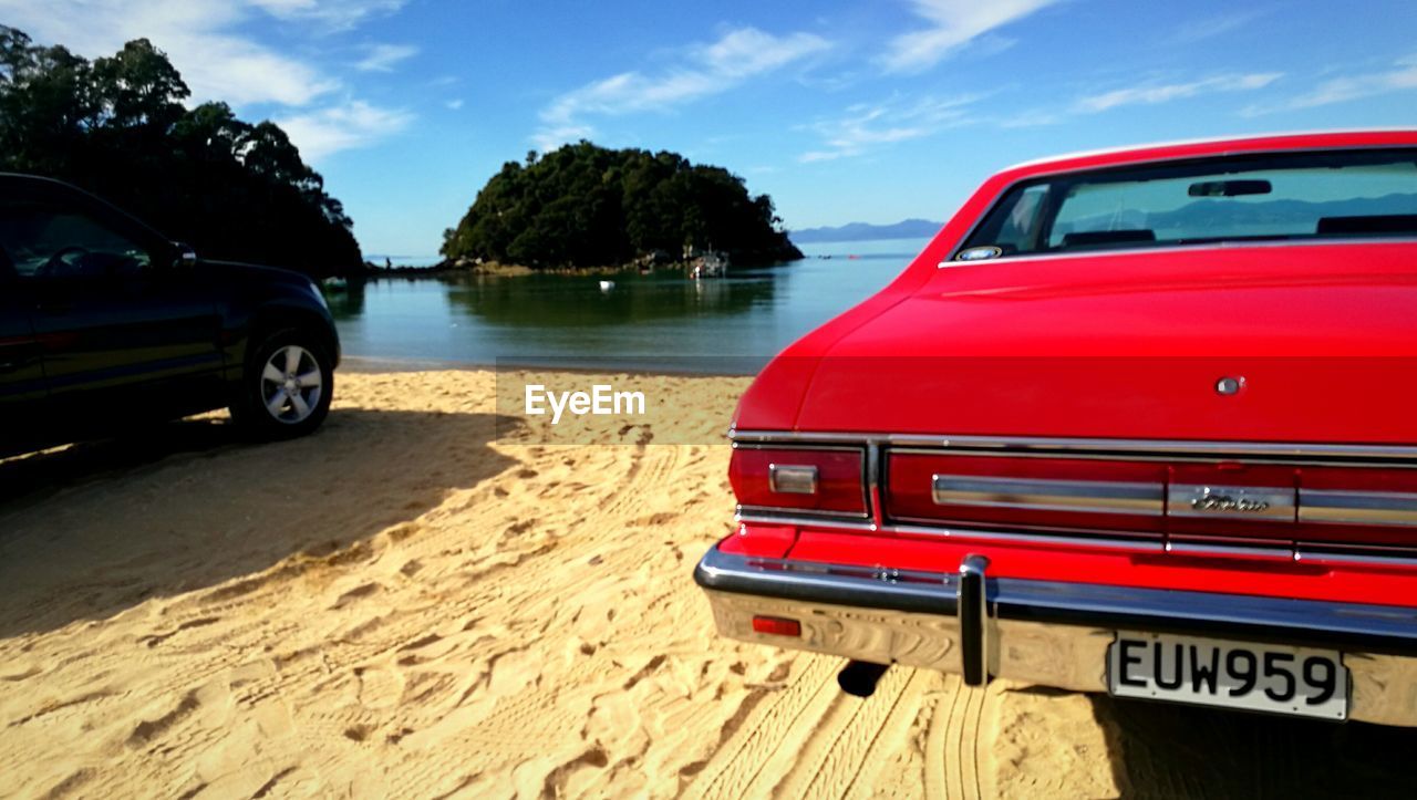 VINTAGE CAR ON BEACH