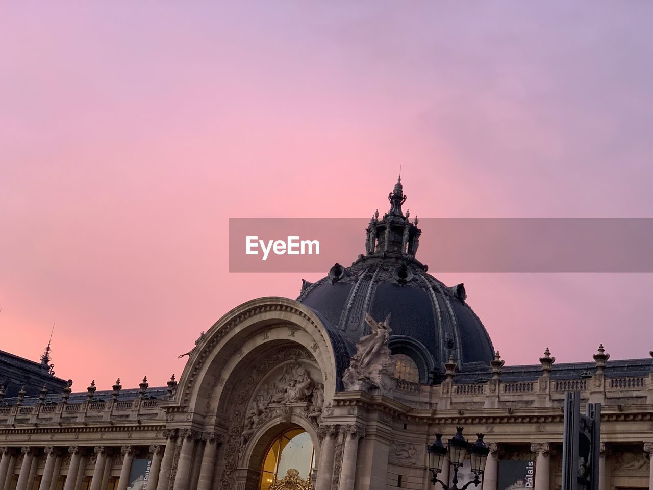 Low angle view of building against sky during sunset