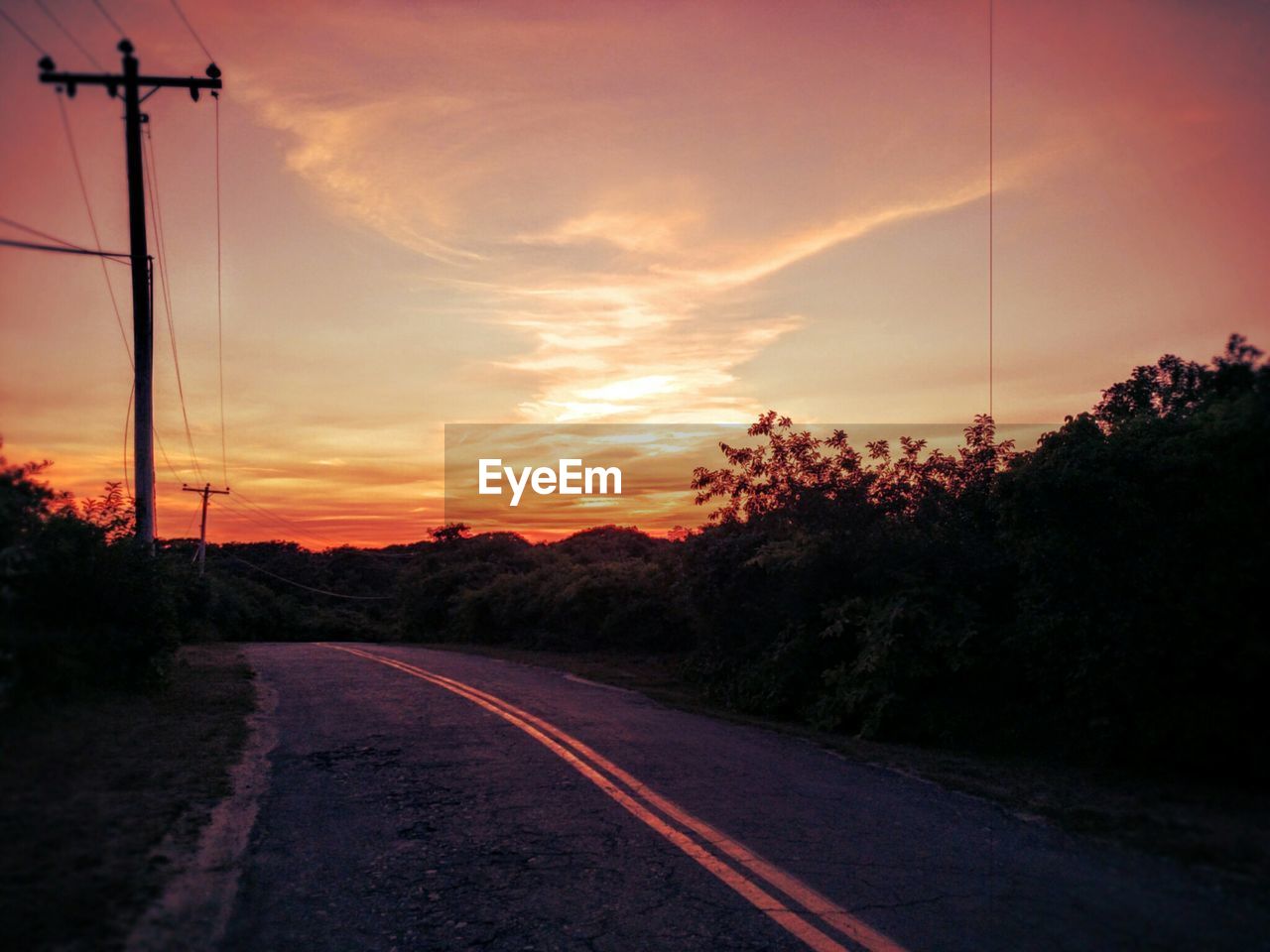 Road against cloudy sky during sunset