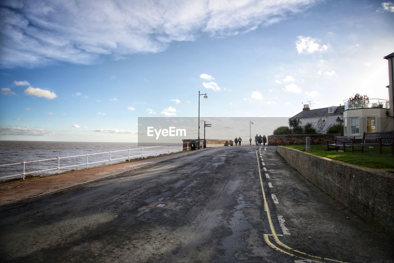 Road by sea against sky