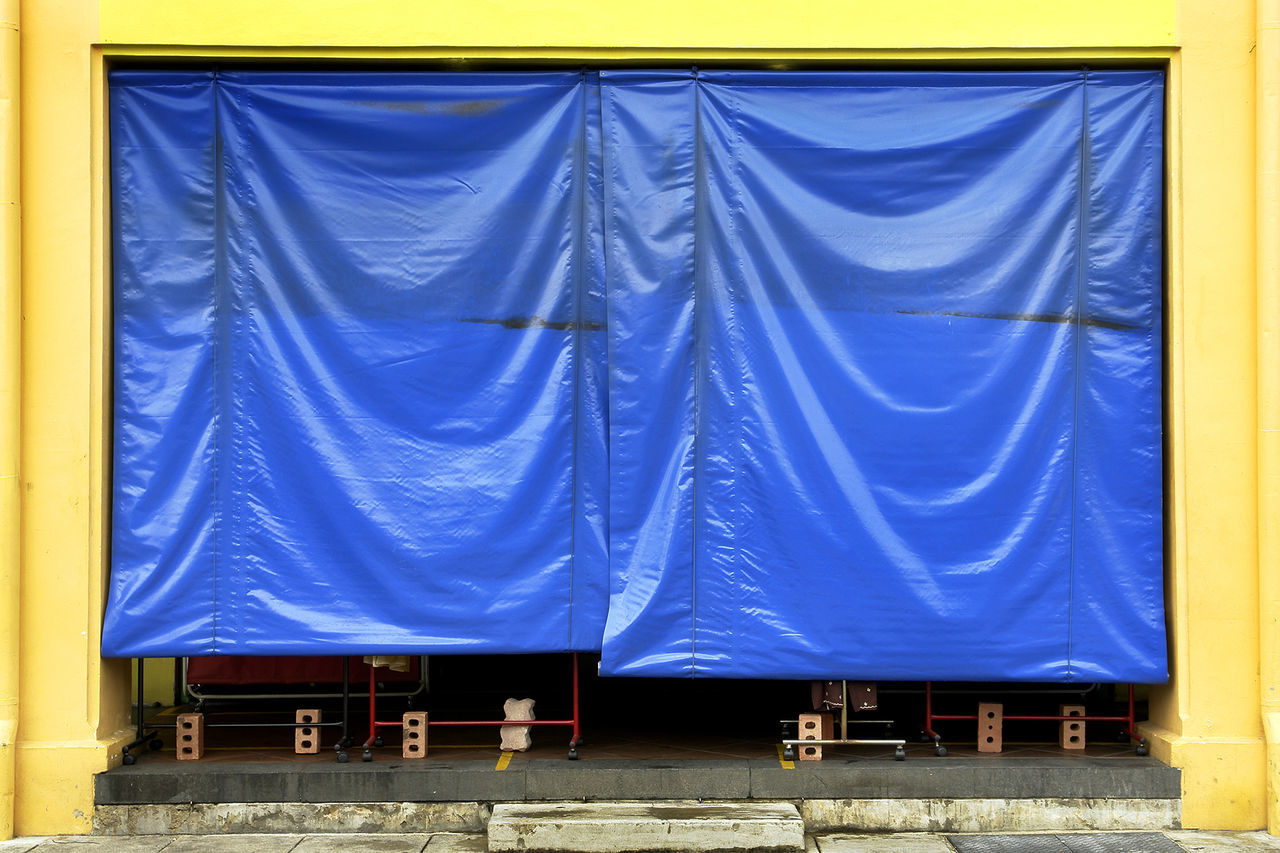 VIEW OF CLOTHES WITH BLUE CURTAIN