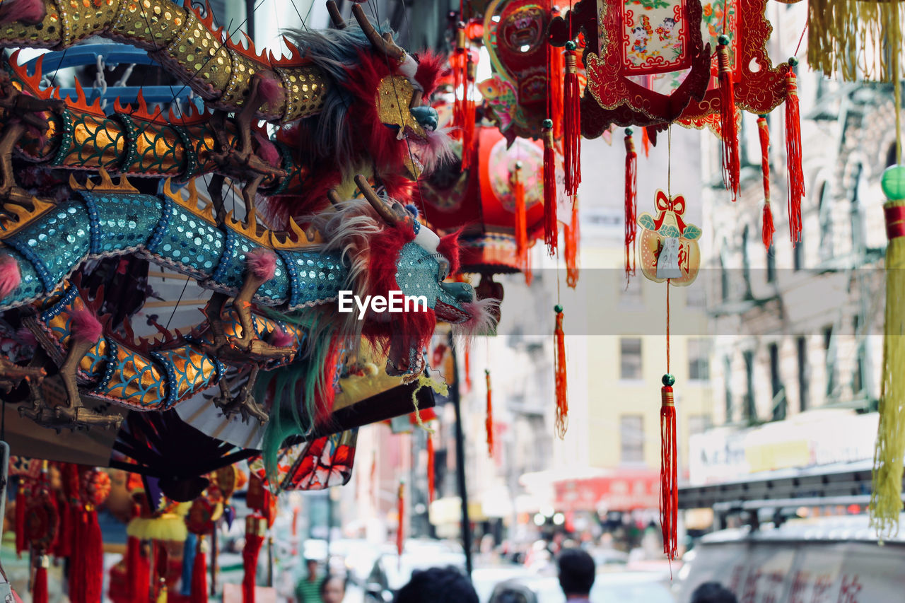 Chinese decorations hanging at market stall 