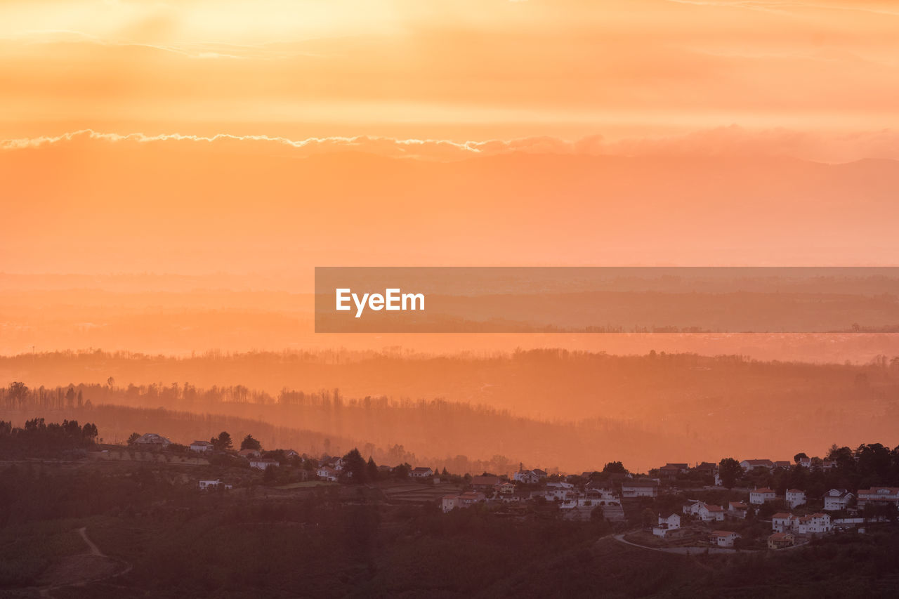 Scenic view of landscape against sky during sunset