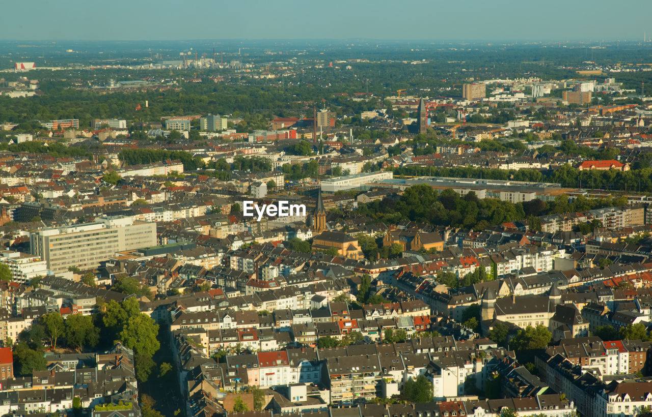 High angle view of buildings in city against sky