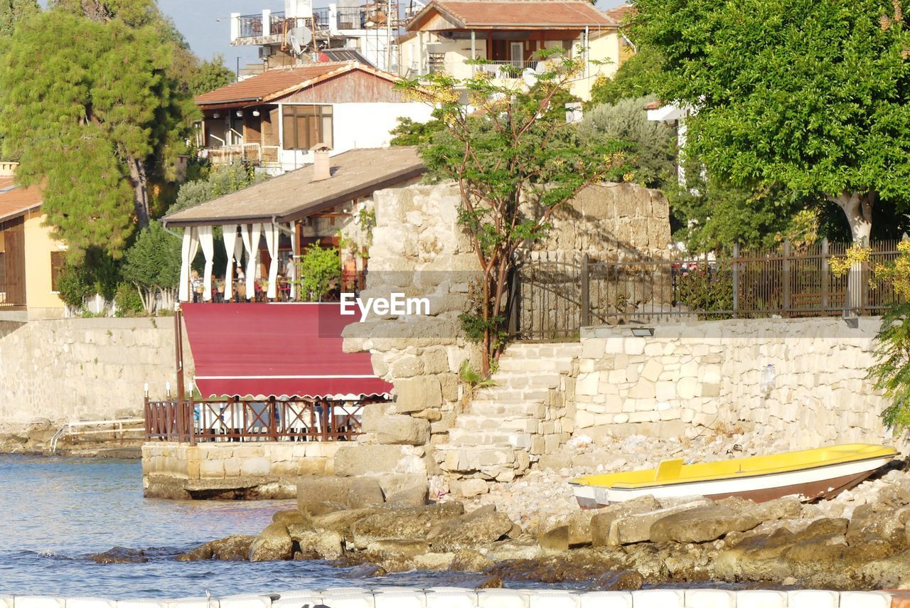 House by lake in town