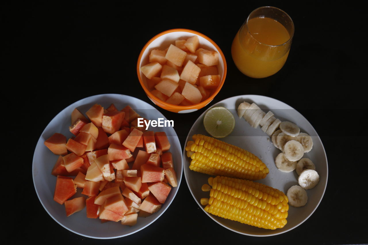 High angle view of food on table against black background