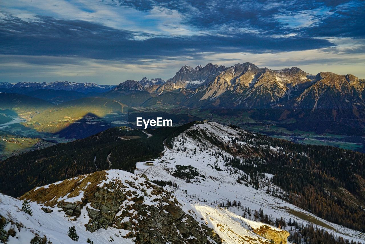 Morning in schladming dachstein scenic view of snowcapped mountains against sky during sunset